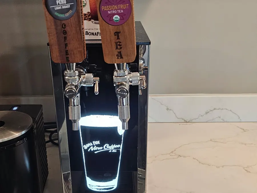Illuminated Bona Fide nitro coffee and tea dispenser installed on a stone counter
