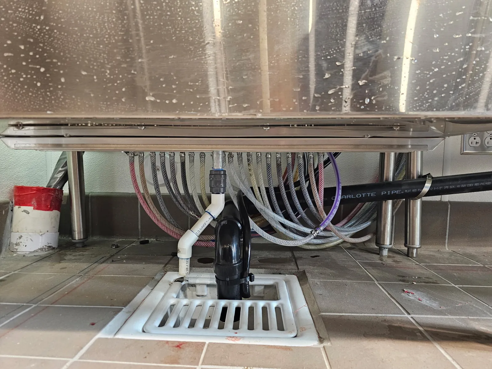 Water and syrup lines run neatly under a stainless beverage counter at Truland Burgers and Greens